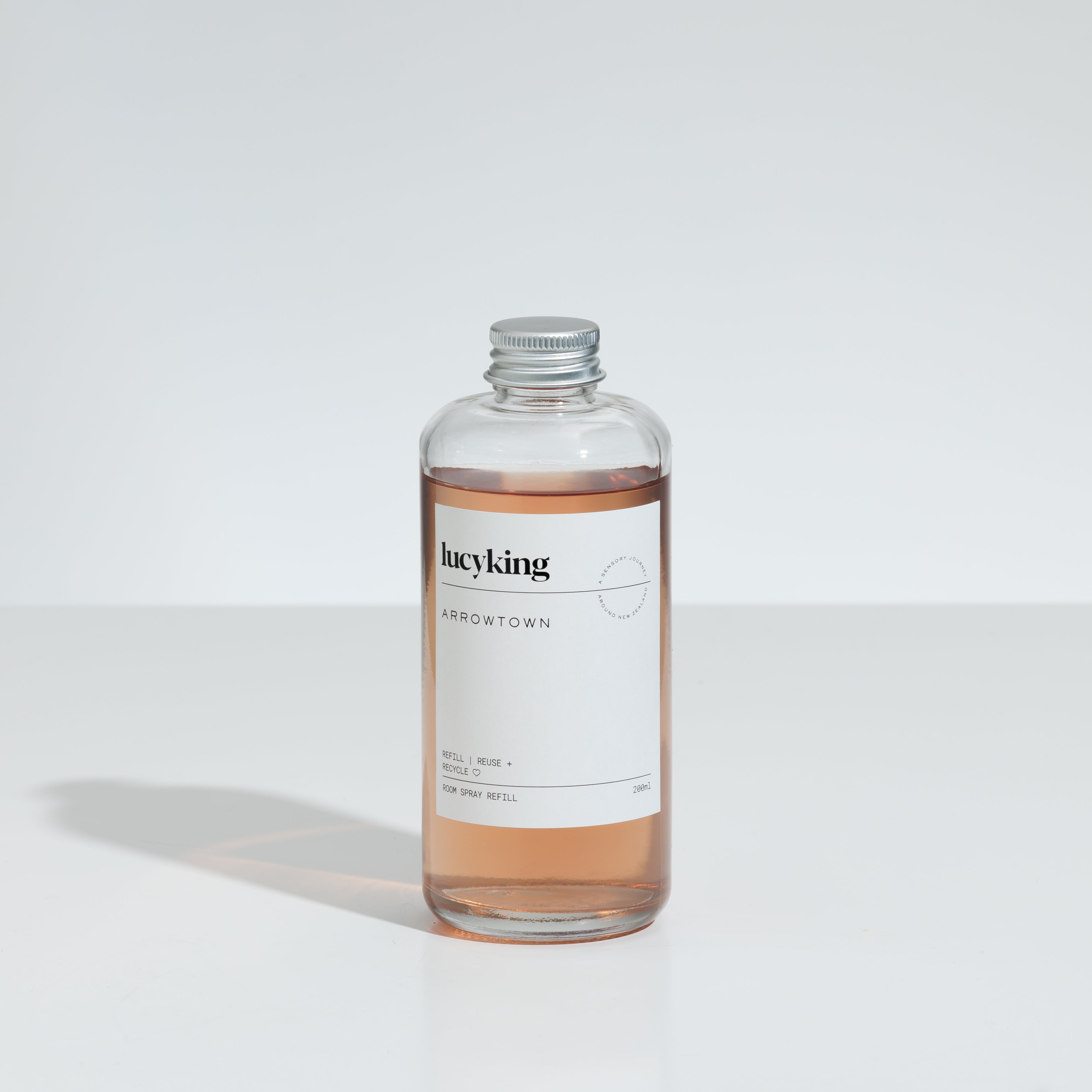 Best selling Arrowtown room and linen spray refill in a clear bottle with a brushed aluminium screwtop lid