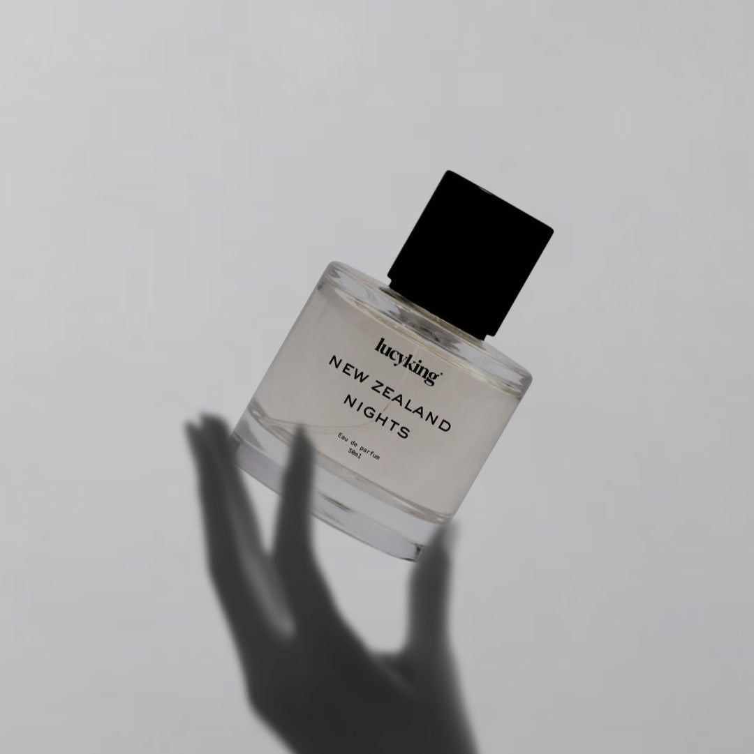 Perfume bottle labeled 'New Zealand Nights' by Lucykin on a light gray background