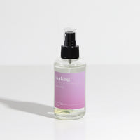 Room Spray in clear bottle with black lid