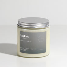 Load image into Gallery viewer, Large best selling Arrowtown soy wax scented candle in a clear glass jar with grey label and brushed aluminium silver screwtop lid
