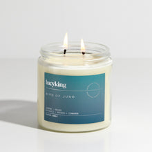 Load image into Gallery viewer, Large signature fragrance Bird Of Juno soy wax scented candle with a burning wick in a clear glass jar with teal label
